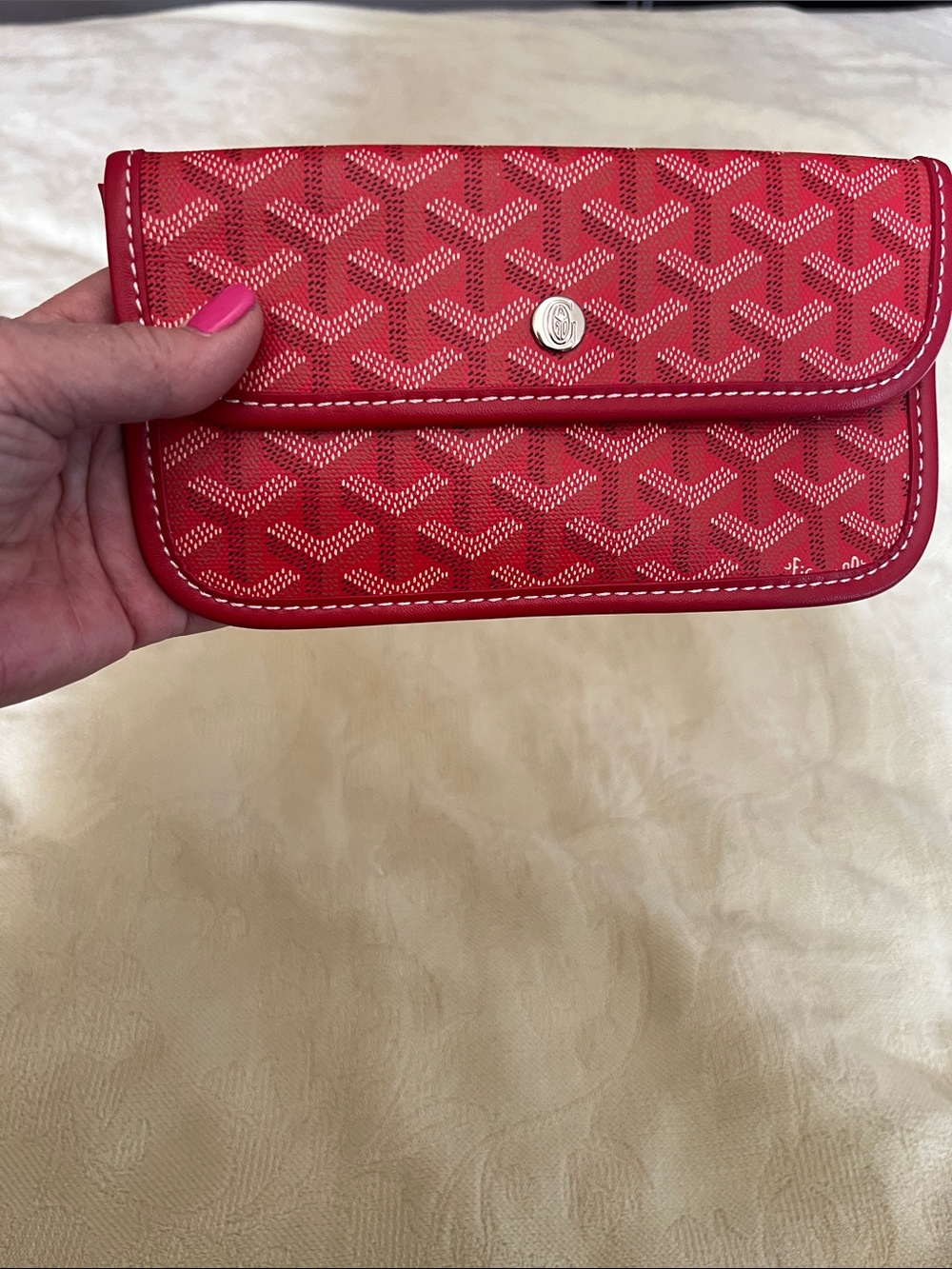 Red wallet from a Goyard bag.  Don’t know if authentic.  From an estate.